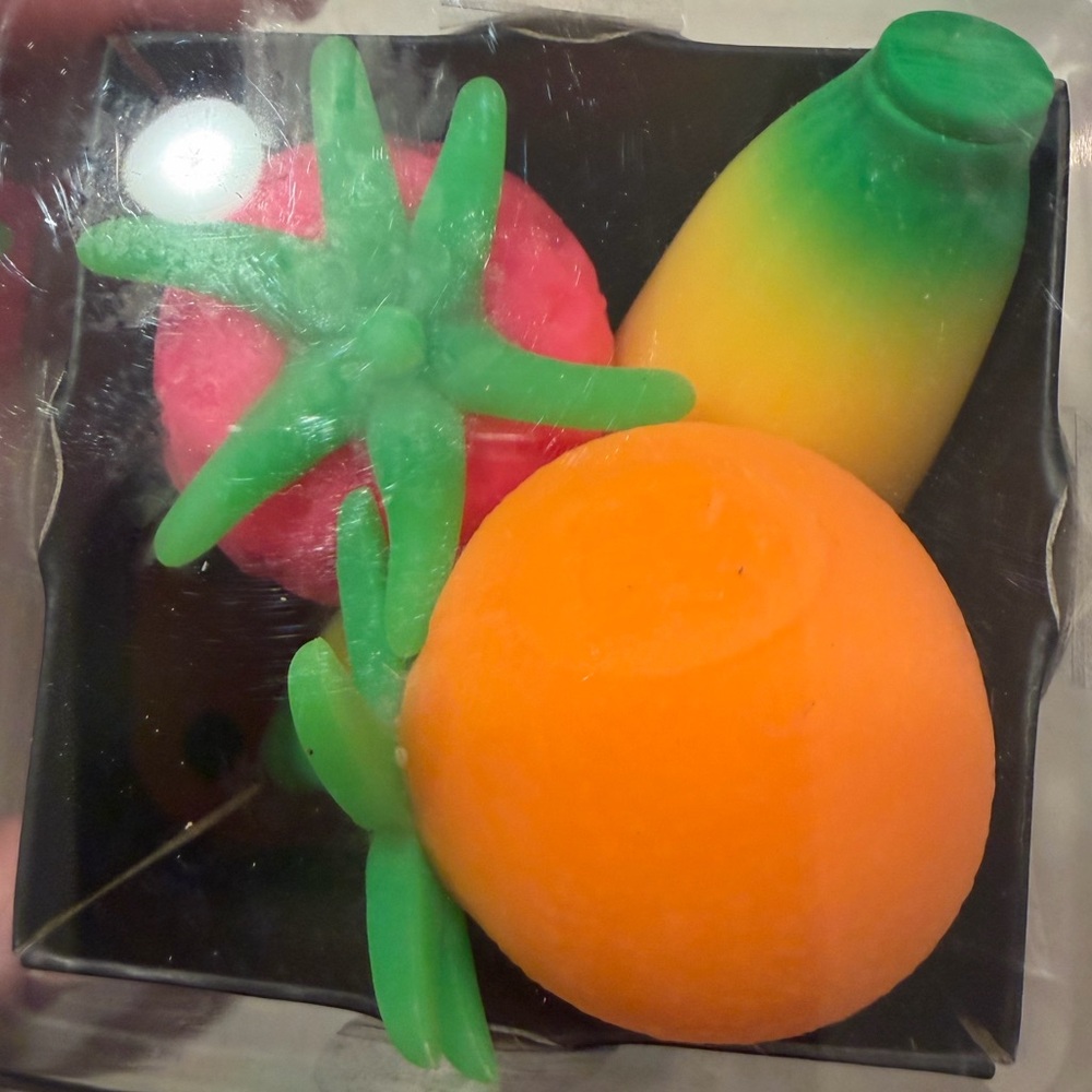 Schylling Groovy NeeDoh Orange Fruit Sensory Toy with Green Leaf - Picture 6 of 6